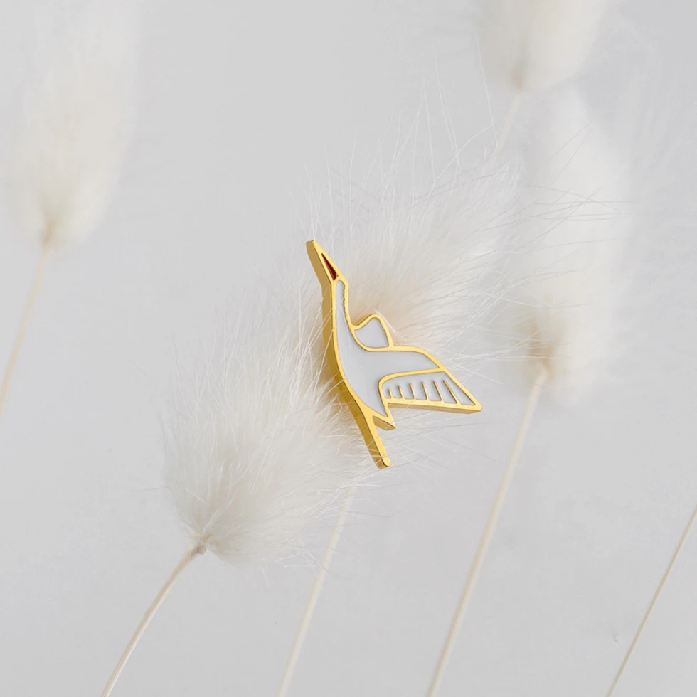 złoty pin bocian
