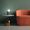 Lampa przenośna Felino bs.living - aranżacja z pomarańczowym fotelem